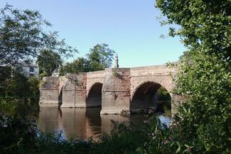 Sunny view of Wilton Bridge over river provided by Ross Photographic Society