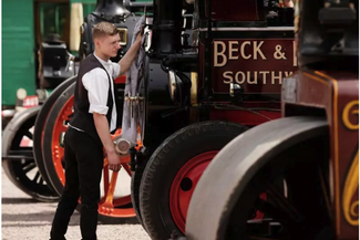 Boy looking at steam engines