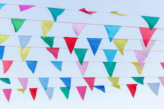 Festival bunting against a blue sky