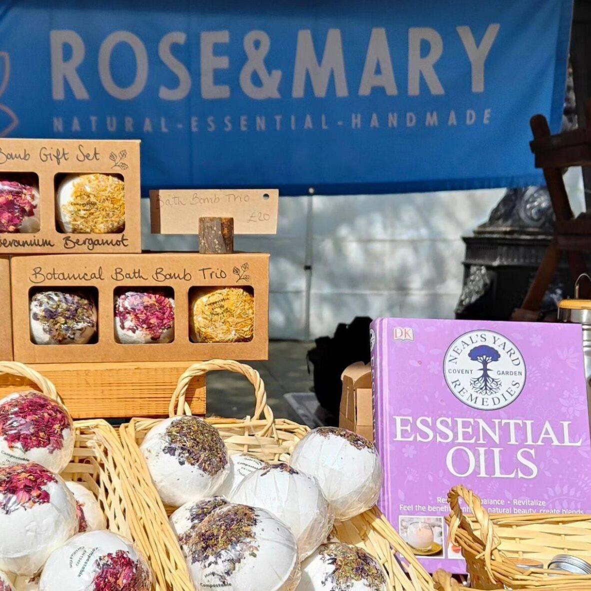 A wide array of natural looking bath bombs on a stall