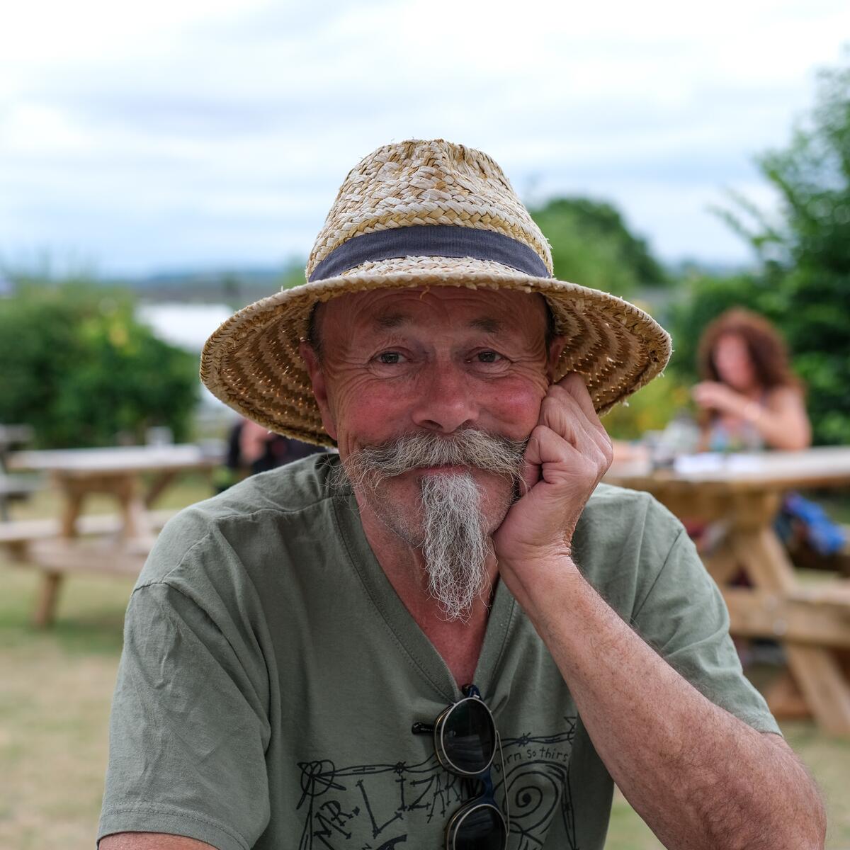 man in a straw hat smiling