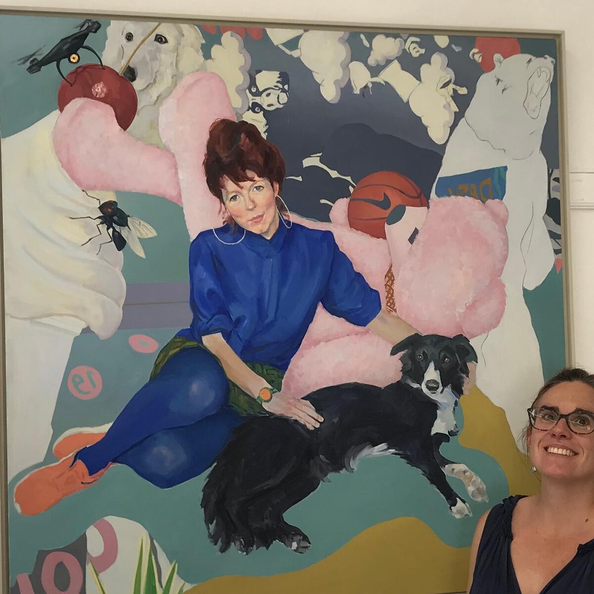 person with a large painting of a woman, dogs, bee and plants