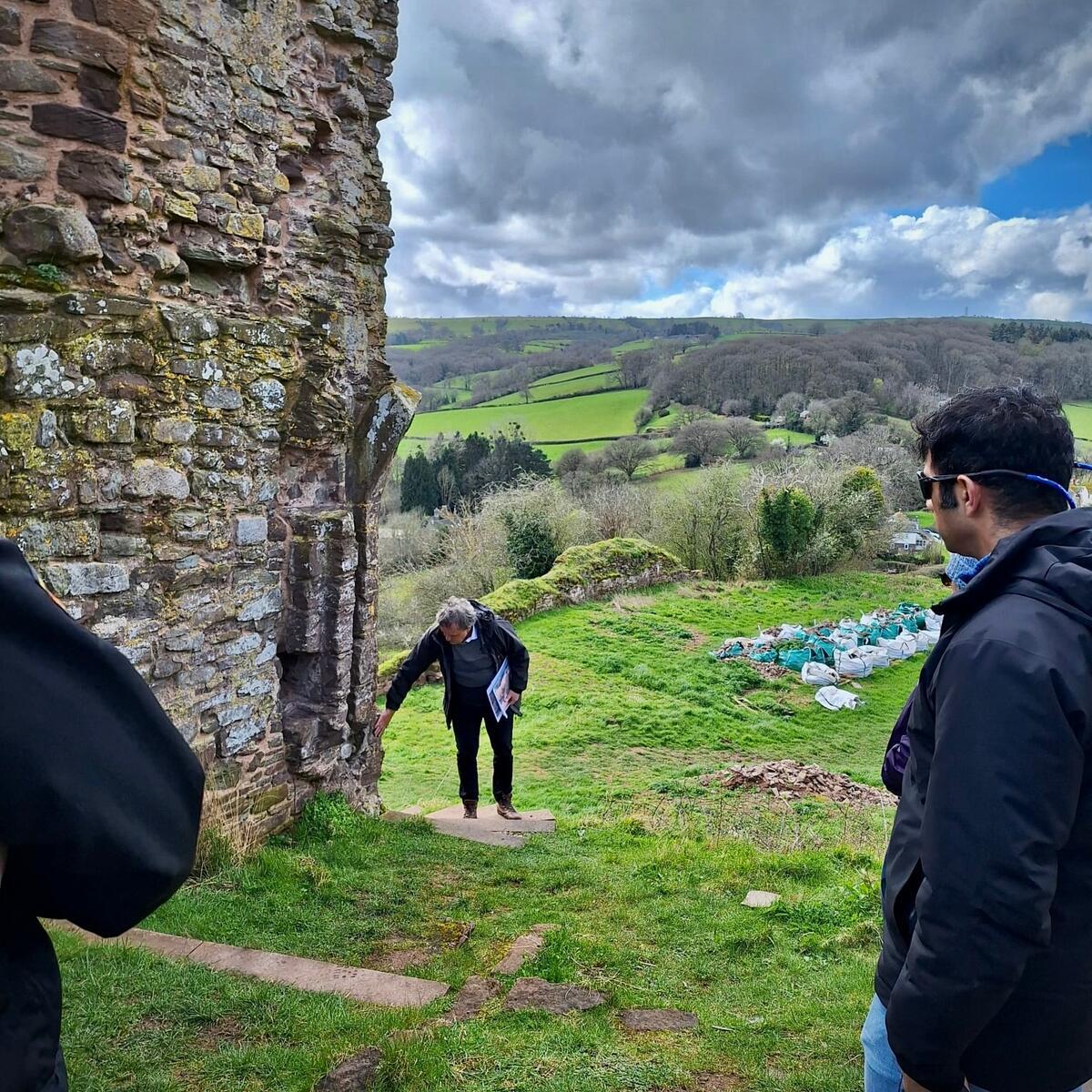 A group of people gathered outside at Snodhill Castle