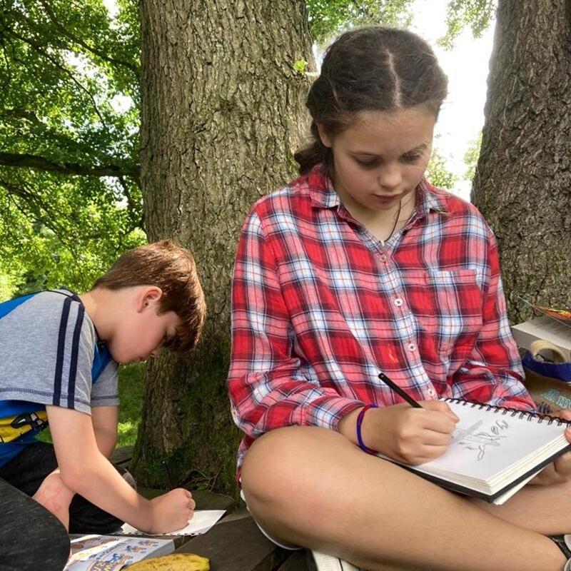 children drawing outside