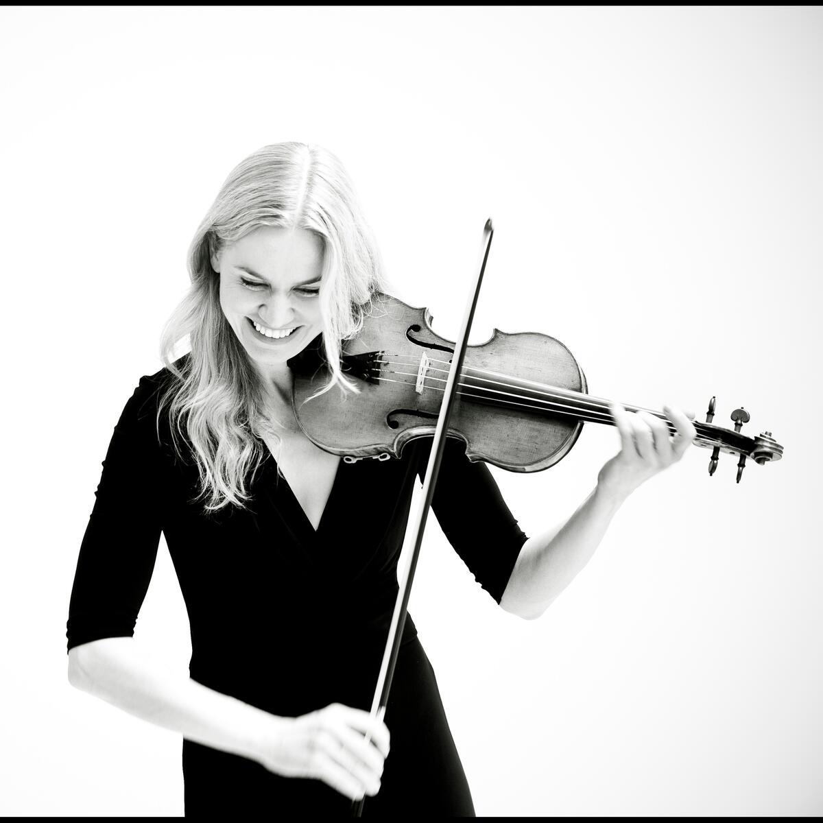 Katherine Gowers - black and white photo of woman playing violin