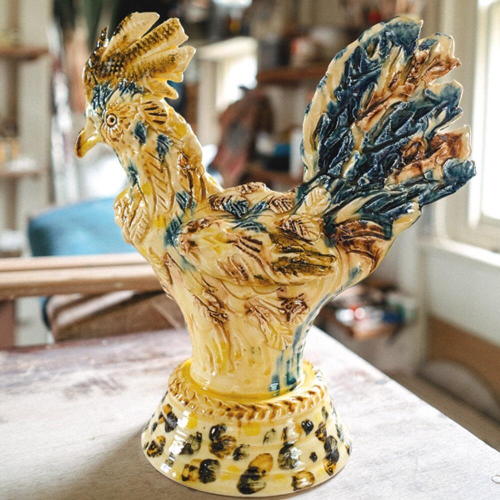 ceramic yellow cockerel with green and red feathers