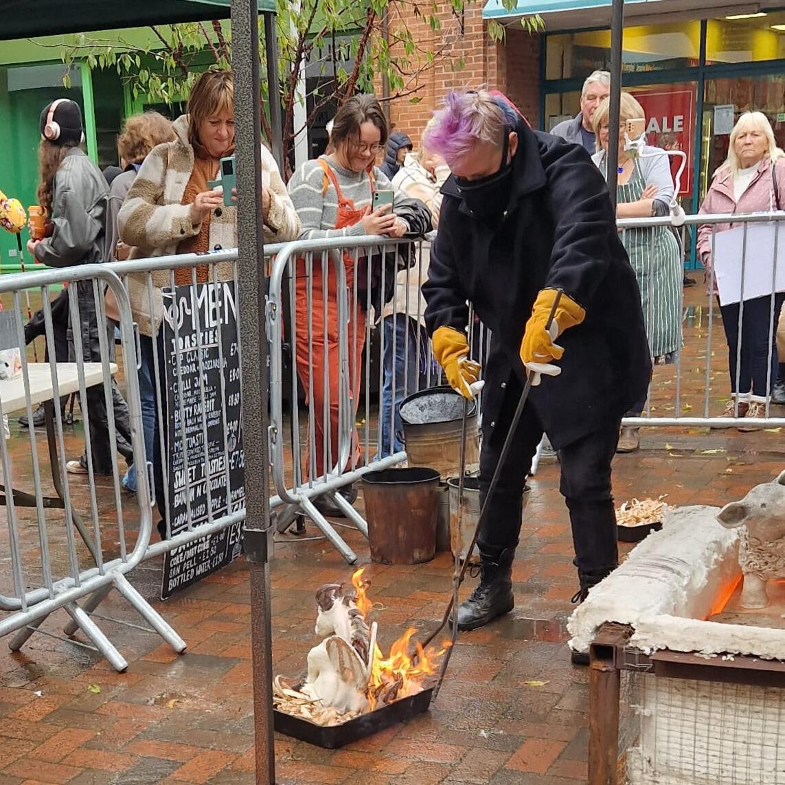 raku pottery being fired as a display outdoors