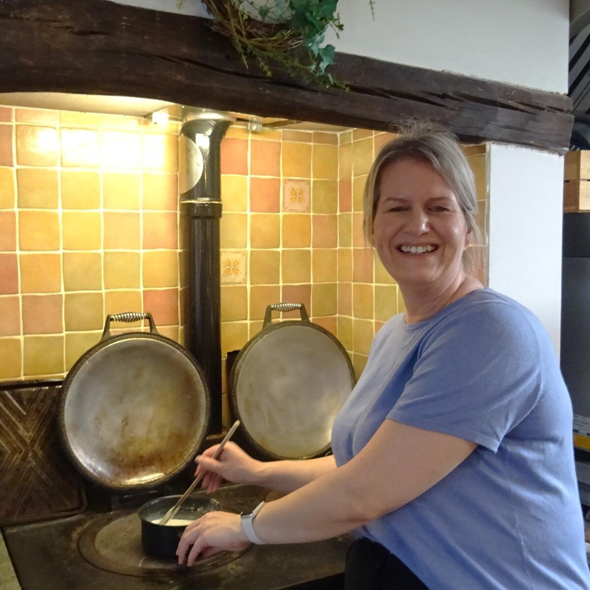 Person making porridge on an ago top