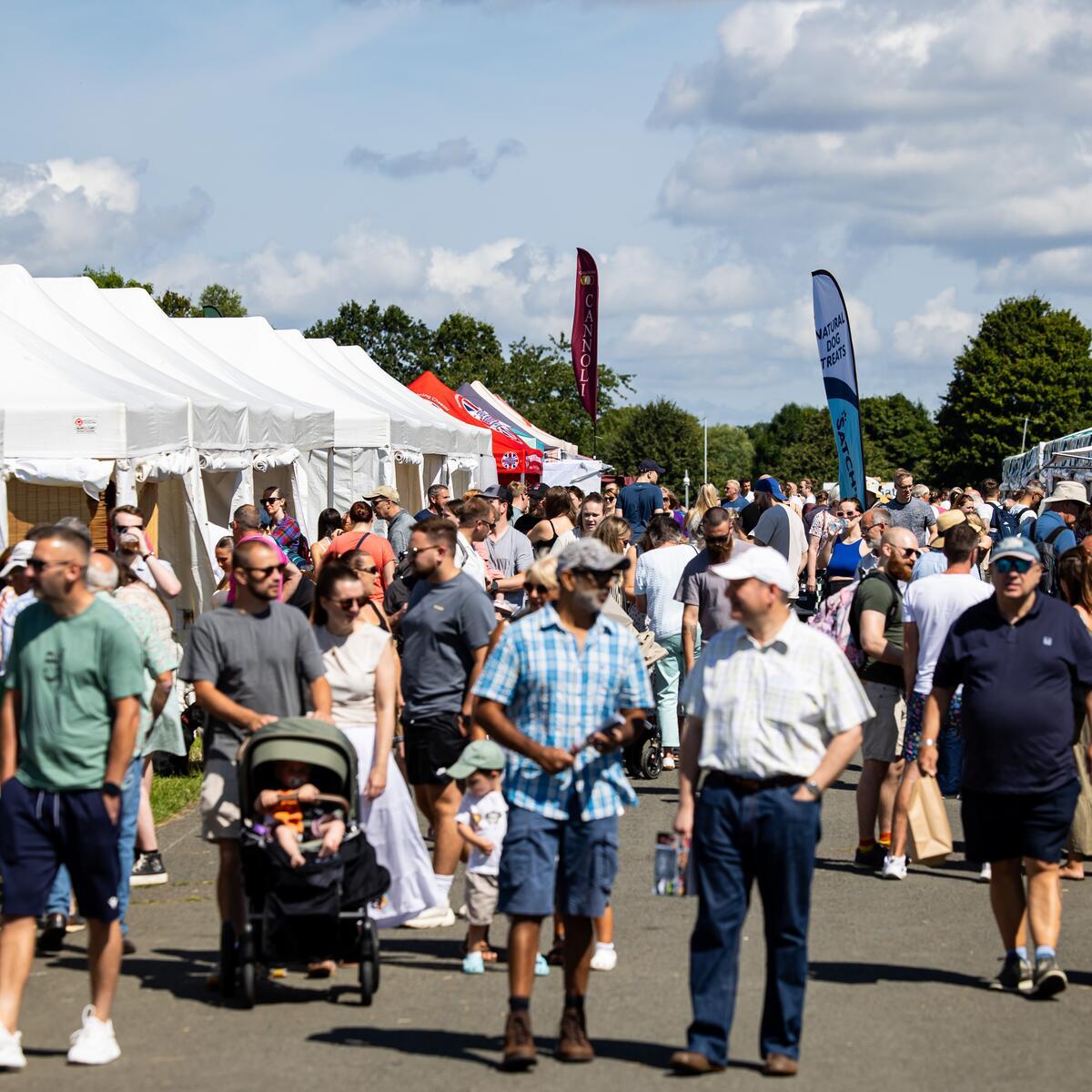 Crowds and food tents at an event