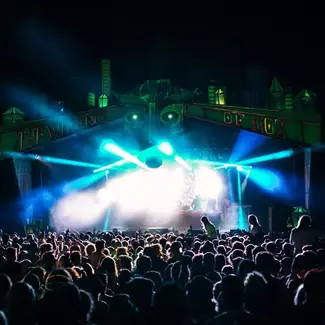 Outdoor crowd with stage and lights