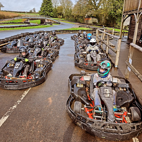 Go karts lined up on the track 