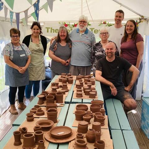 People smiling after pottery