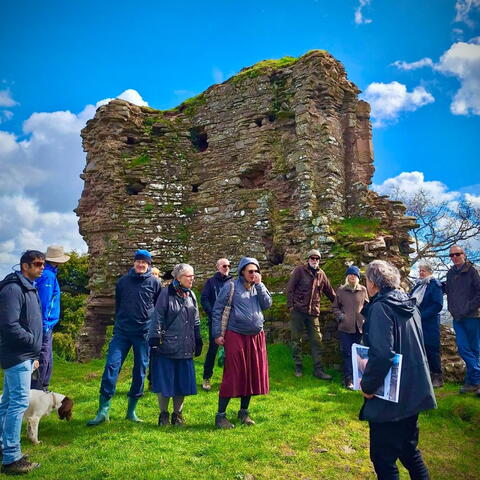 People gathered by Snodhill Castle