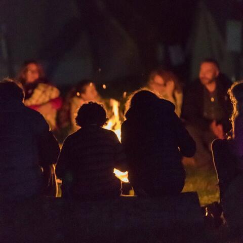 People gathered around a bonfire