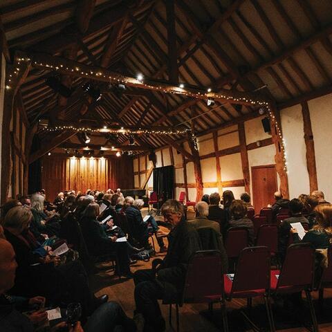 Full audience at a concert inside Hellens Manor 