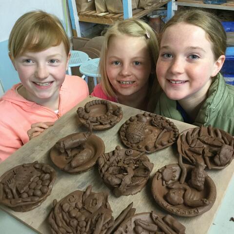 Young people with clay 'makes'