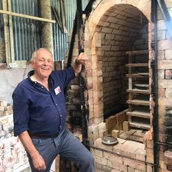 man with brick kiln oven