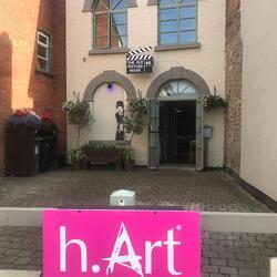 h-Art sign in front of a building