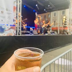 cup of cider in front of stage