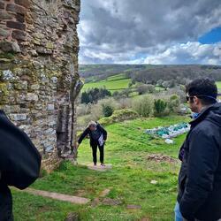 A group of people gathered outside at Snodhill Castle